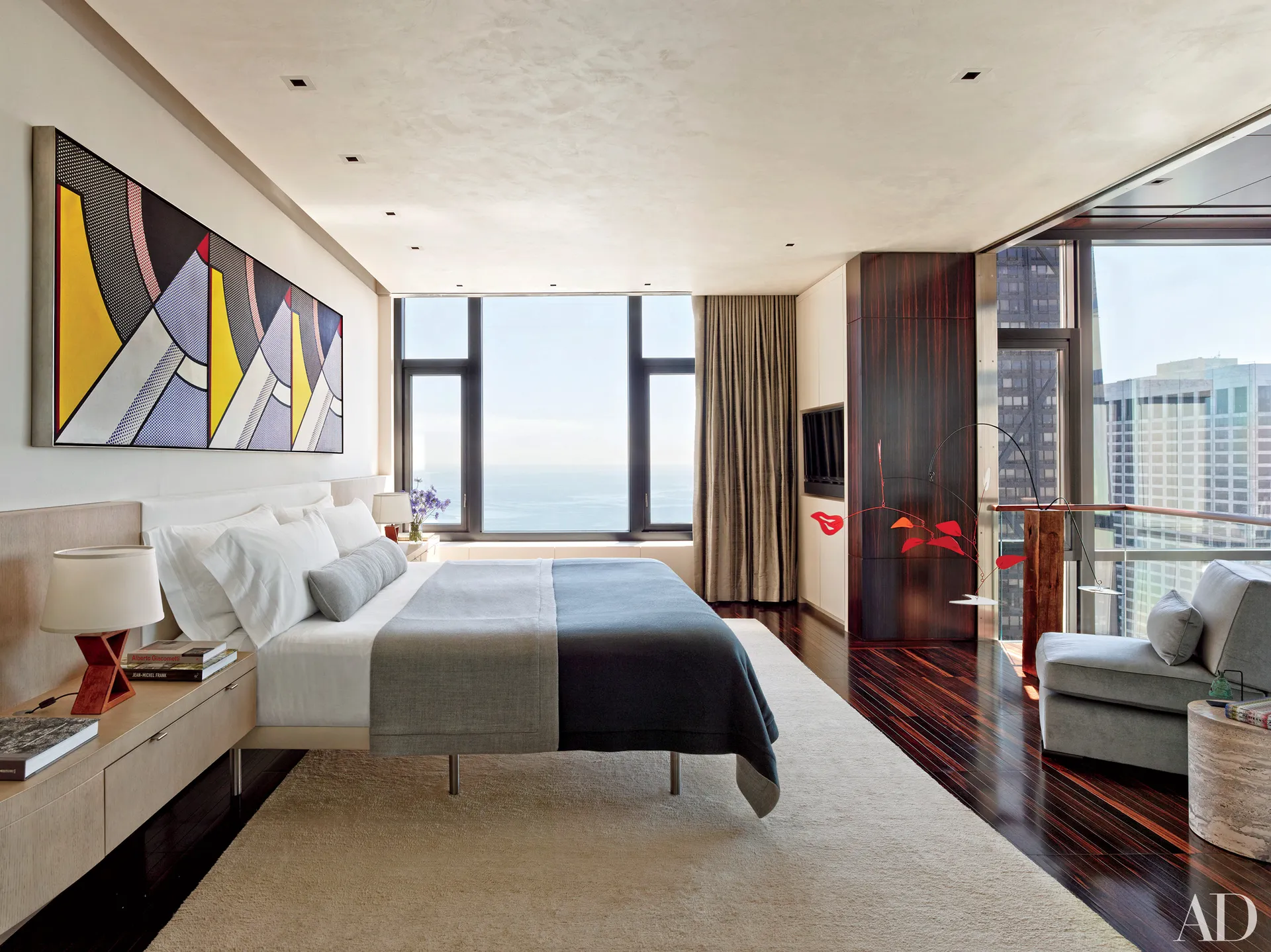 Sleek bedroom, city view.