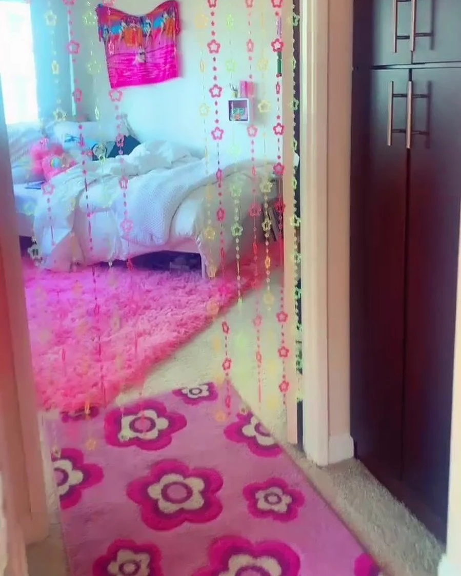 Y2K Bedroom Ideas for Teenage Girls: Colorful beaded star curtains with pink rugs.