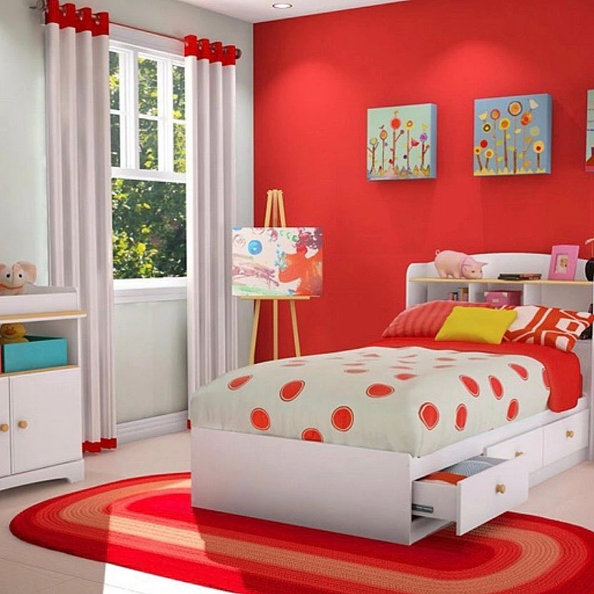 Red accent wall with playful polka dot bedding.