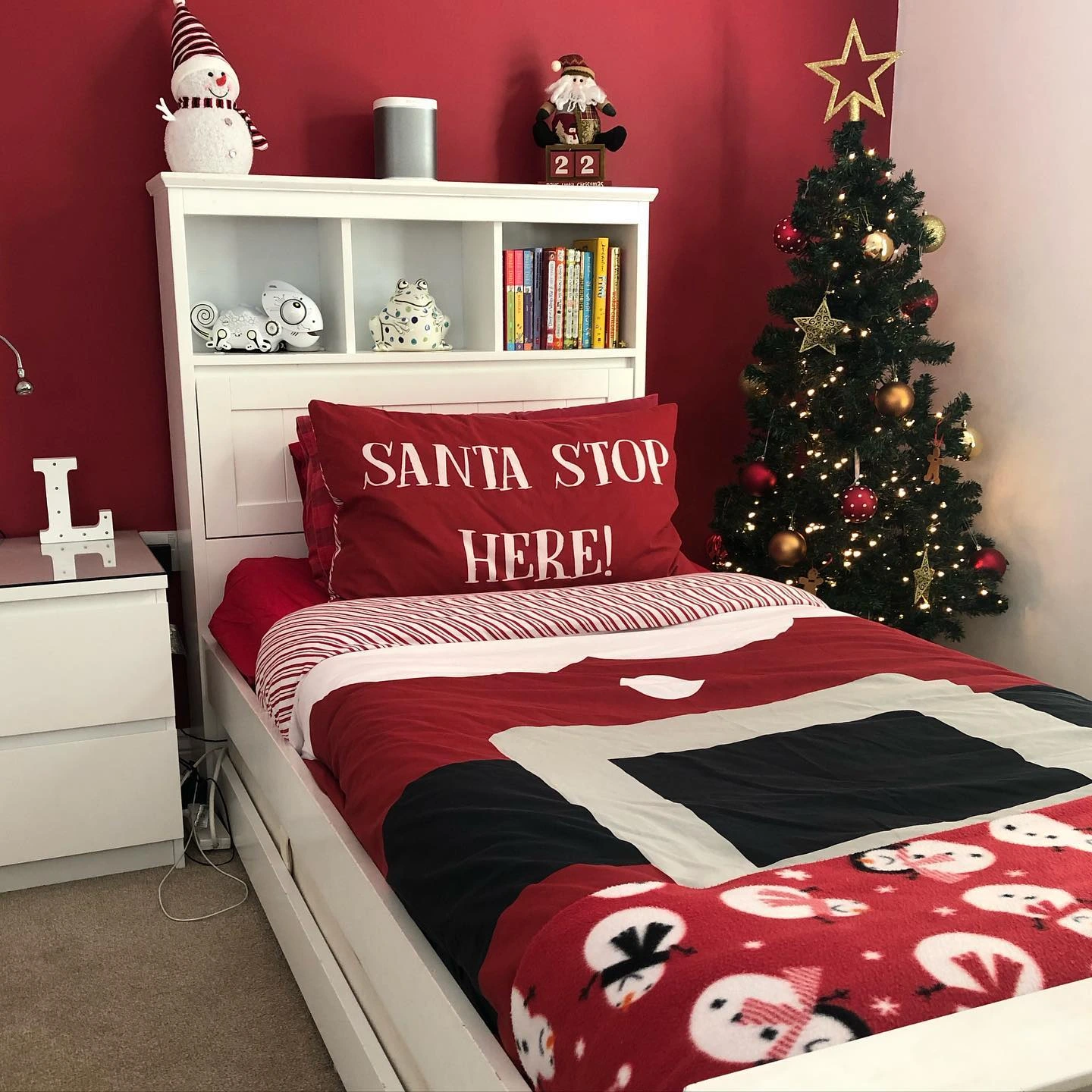 Festive red bedroom with holiday decorations.