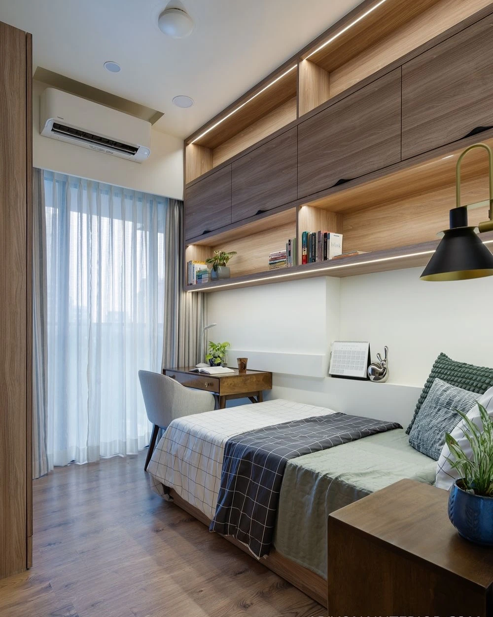 Sleek bedroom with built-in wooden storage