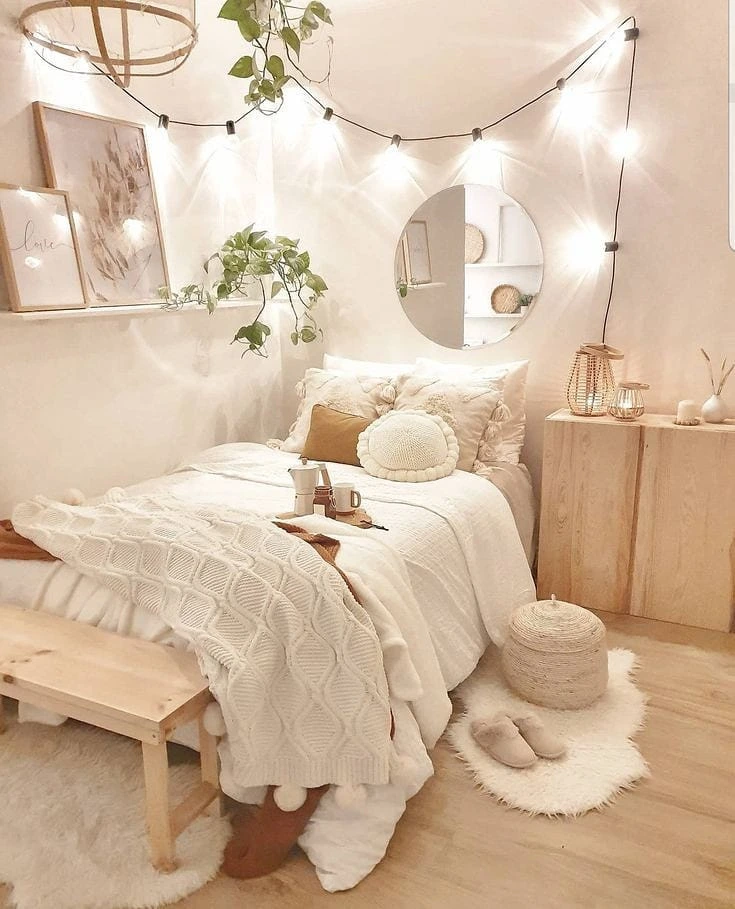 Cozy boho bedroom with string lights and plants
