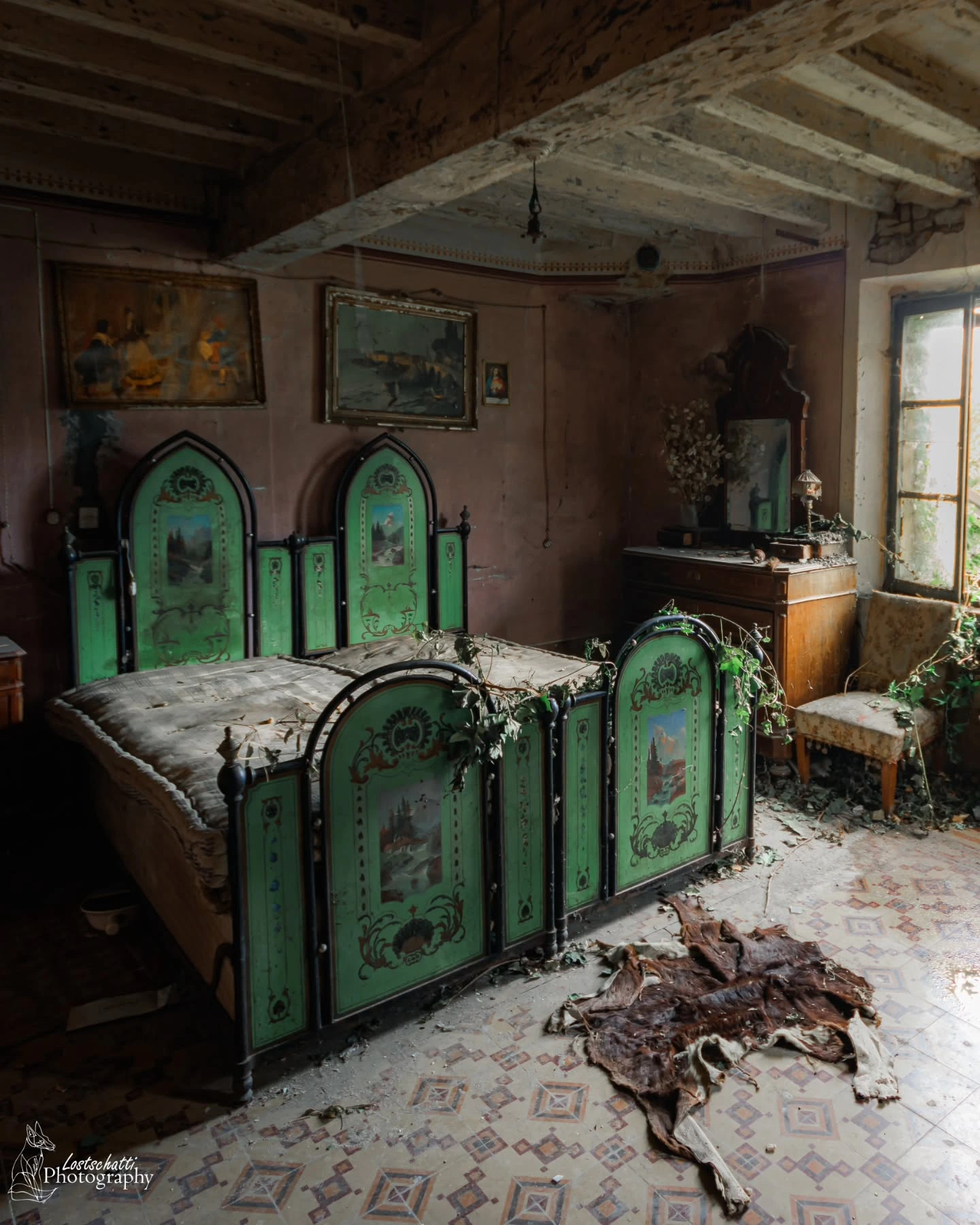 Ornate antique bed in a weathered room.  