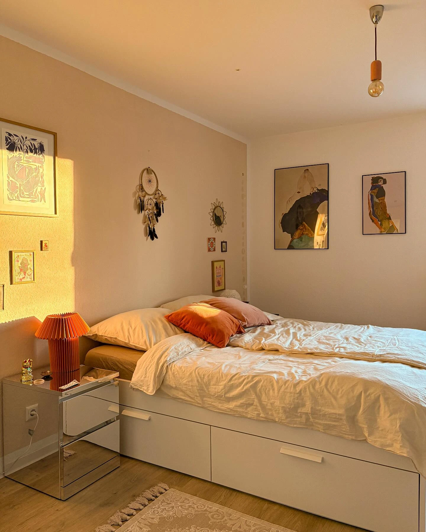 Boho Bedroom Ideas for Teens: A bed with storage and art wall.