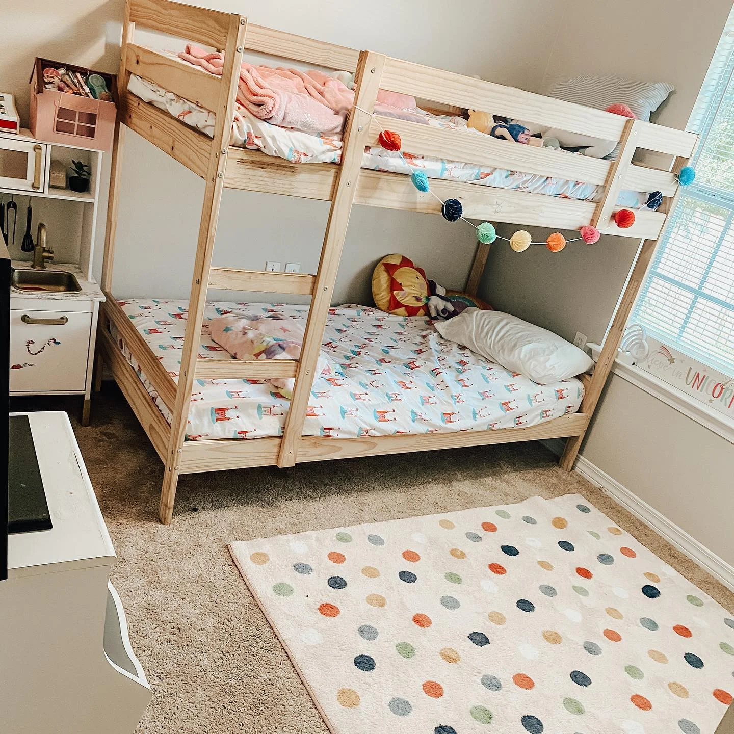 Wooden bunk bed with colorful decor