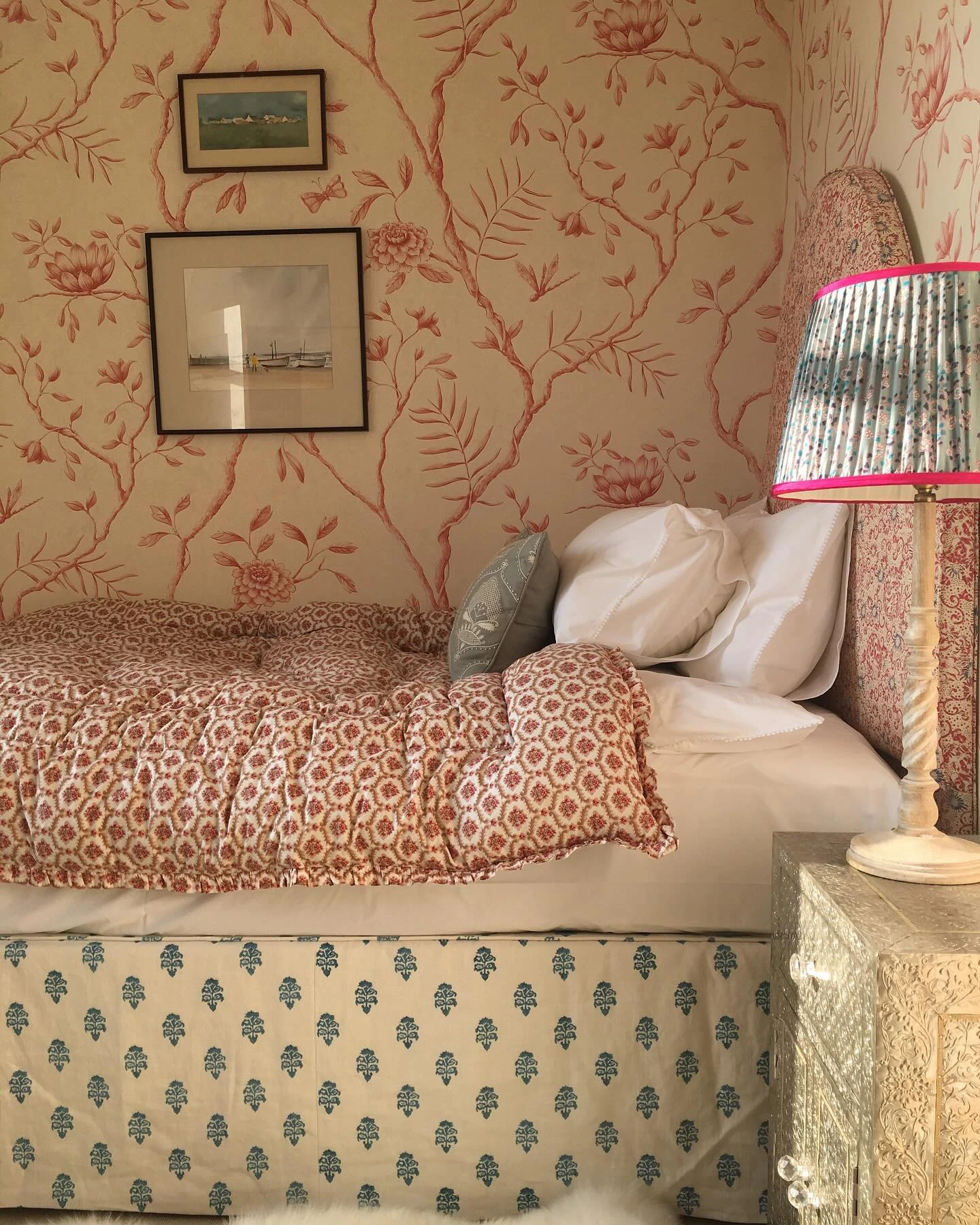 Child's room with pastel walls and string lights.