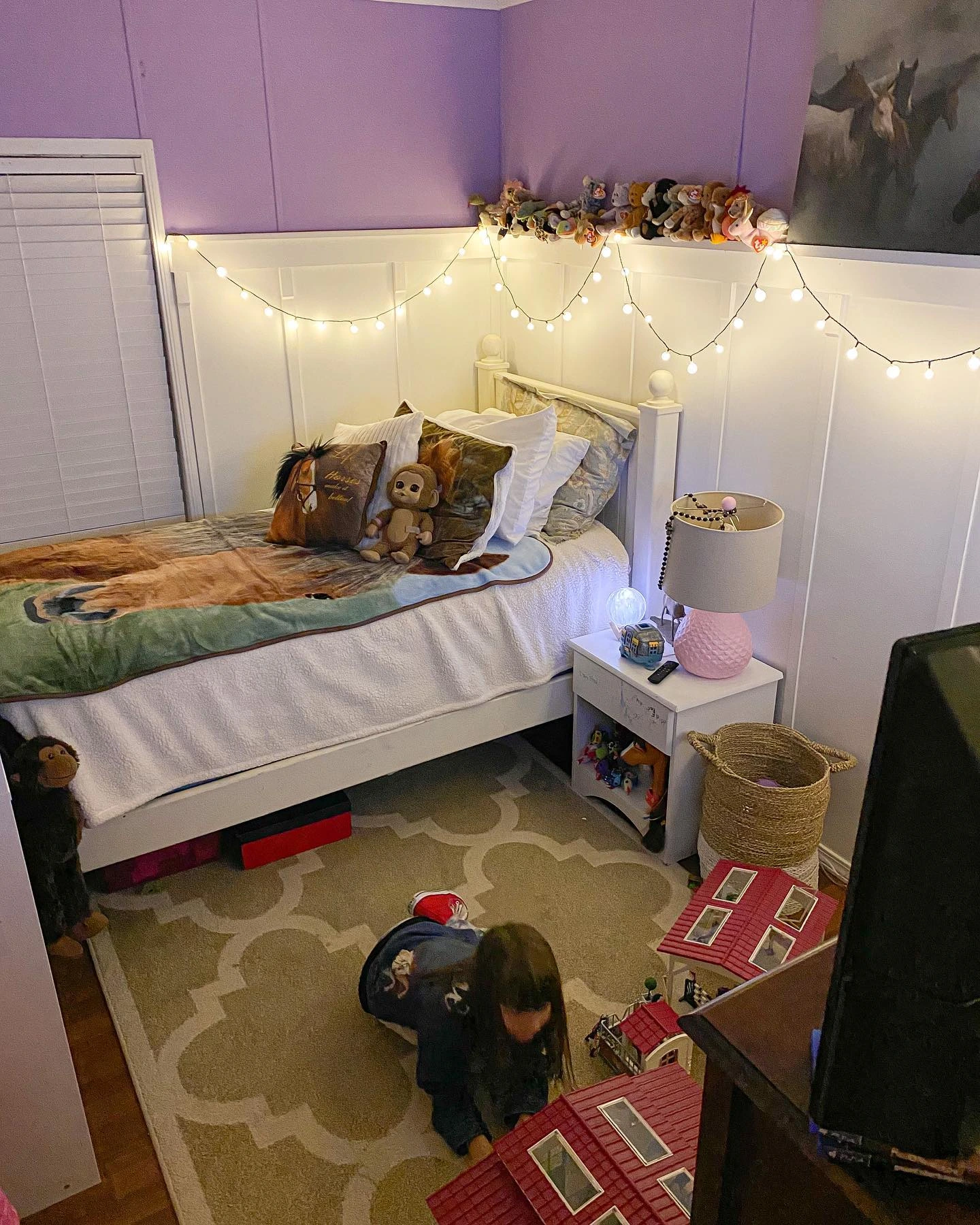 Elegant bedroom with a feature wallpaper and white bed.