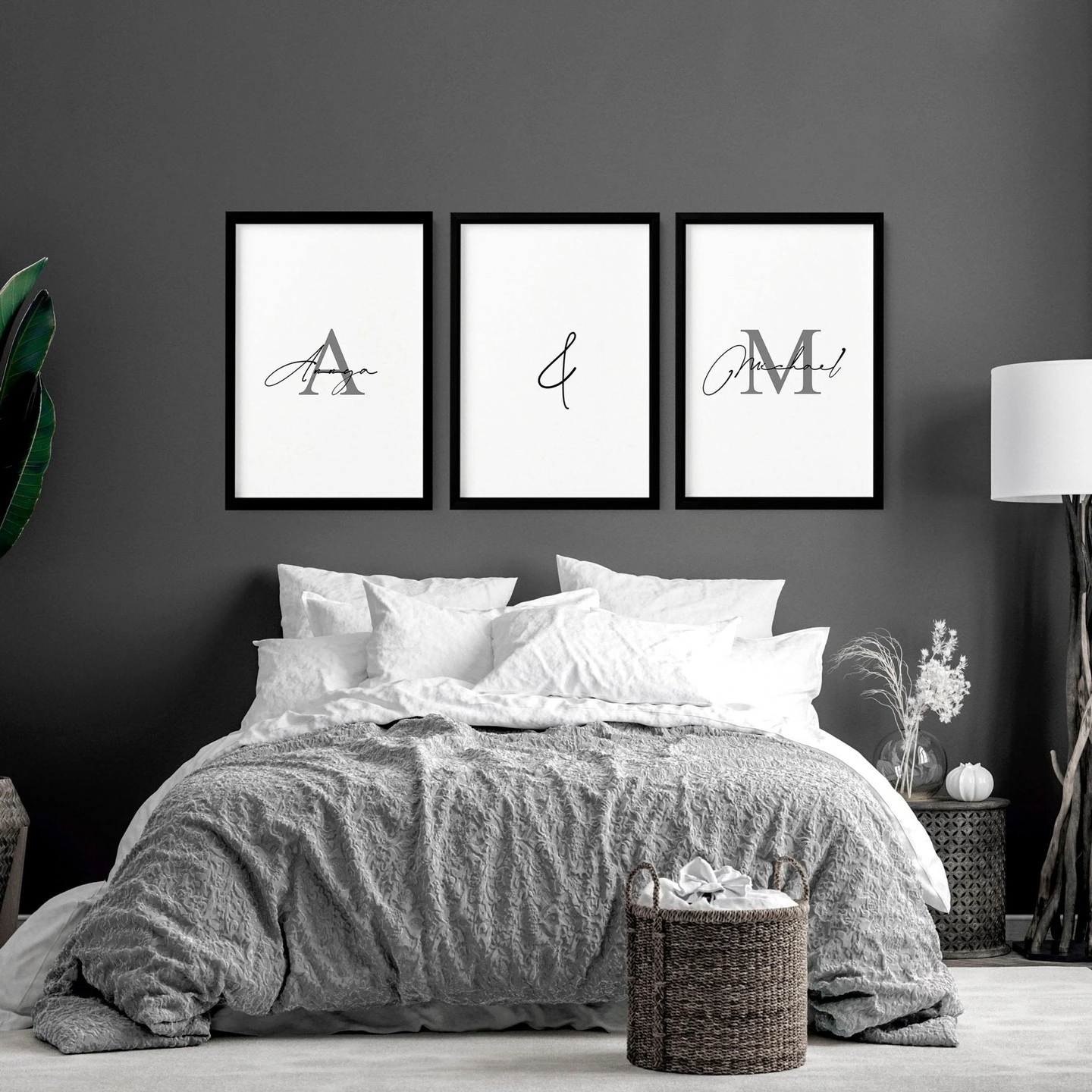 Bedroom with a dark gray wall and personalized monogram art.