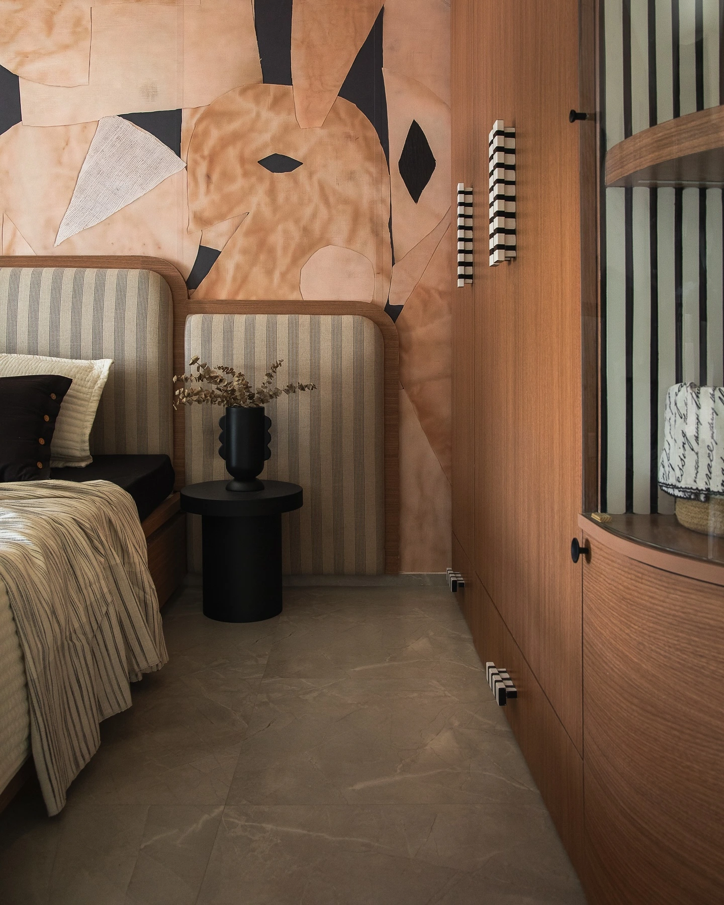 Small bedroom with large abstract art wall.
