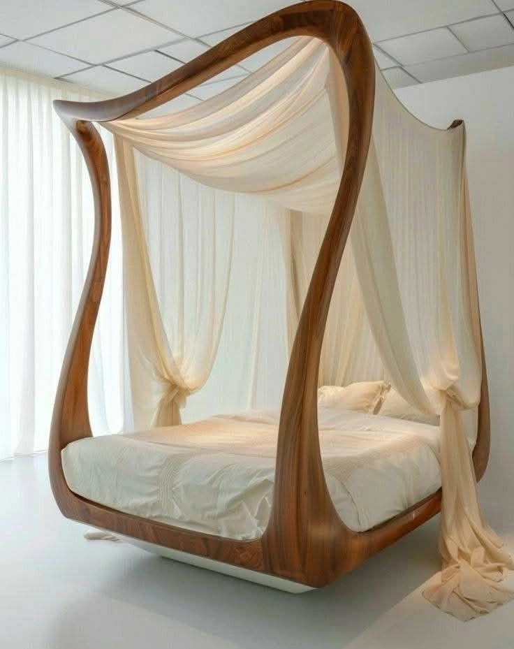 Floating canopy bed with sheer drapes.
