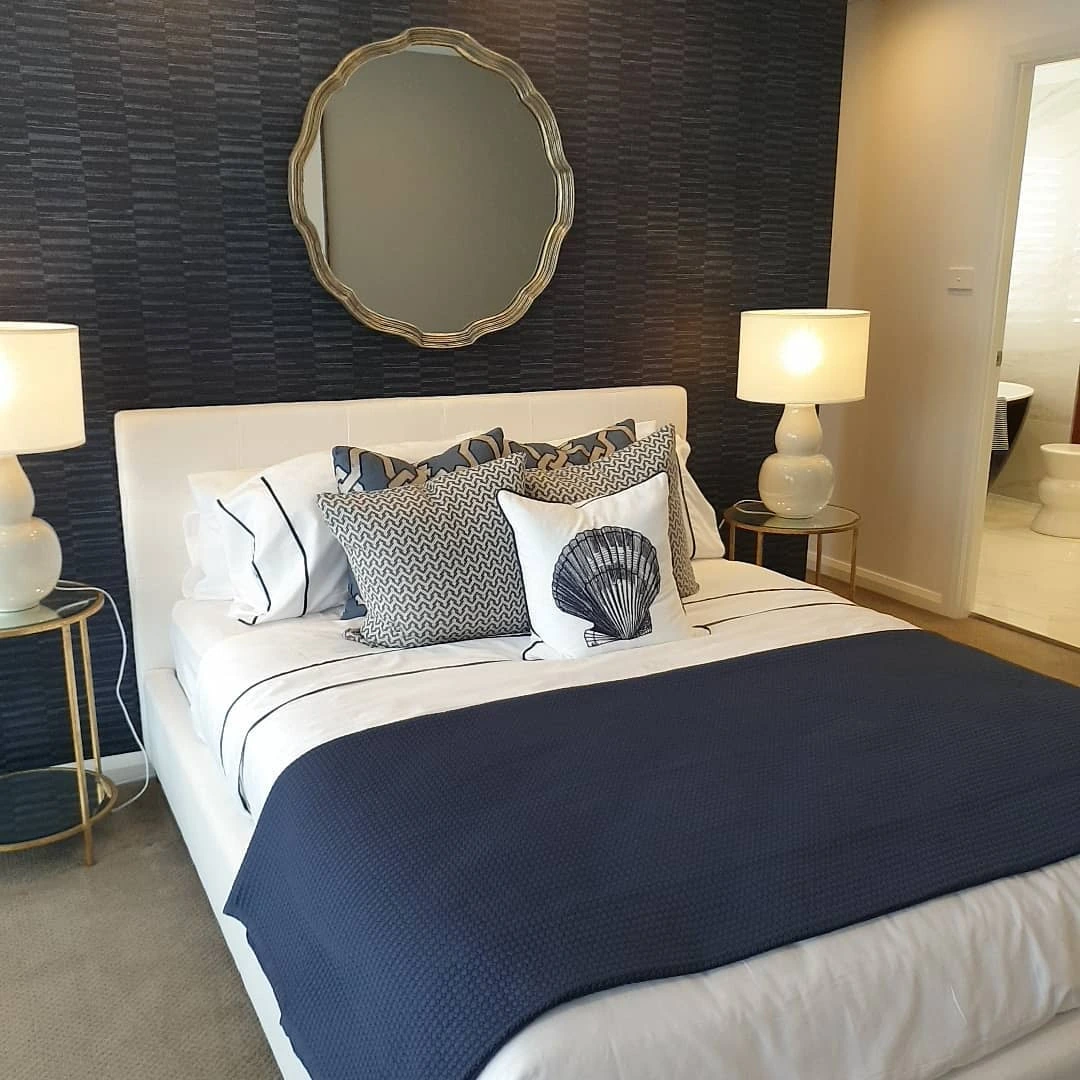 Navy bedroom with textured wallpaper