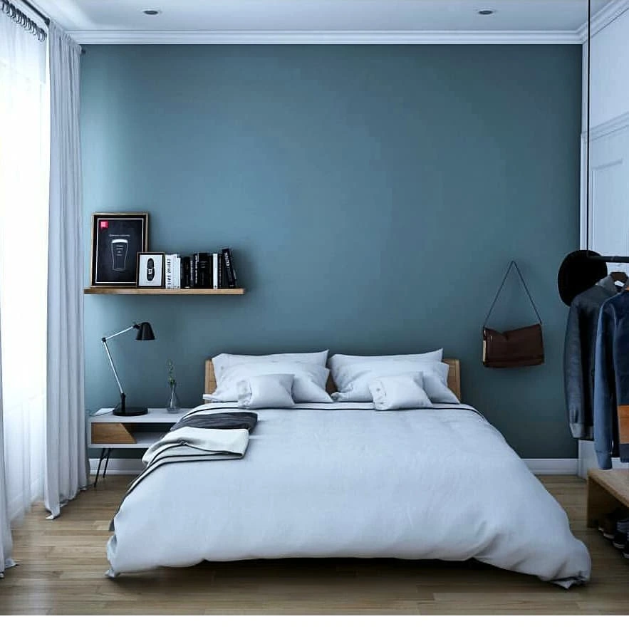 Aqua accent wall bedroom with floating shelf