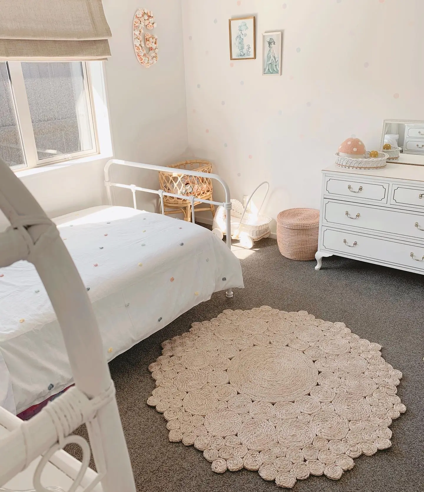 Bedroom with light polka dot walls.  