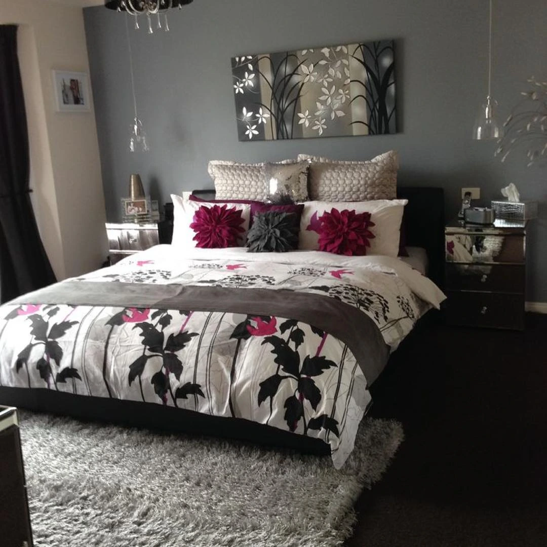 Bed with a bold floral duvet cover.  