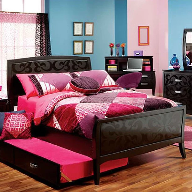 Bedroom with a mix of colorful patterns.  