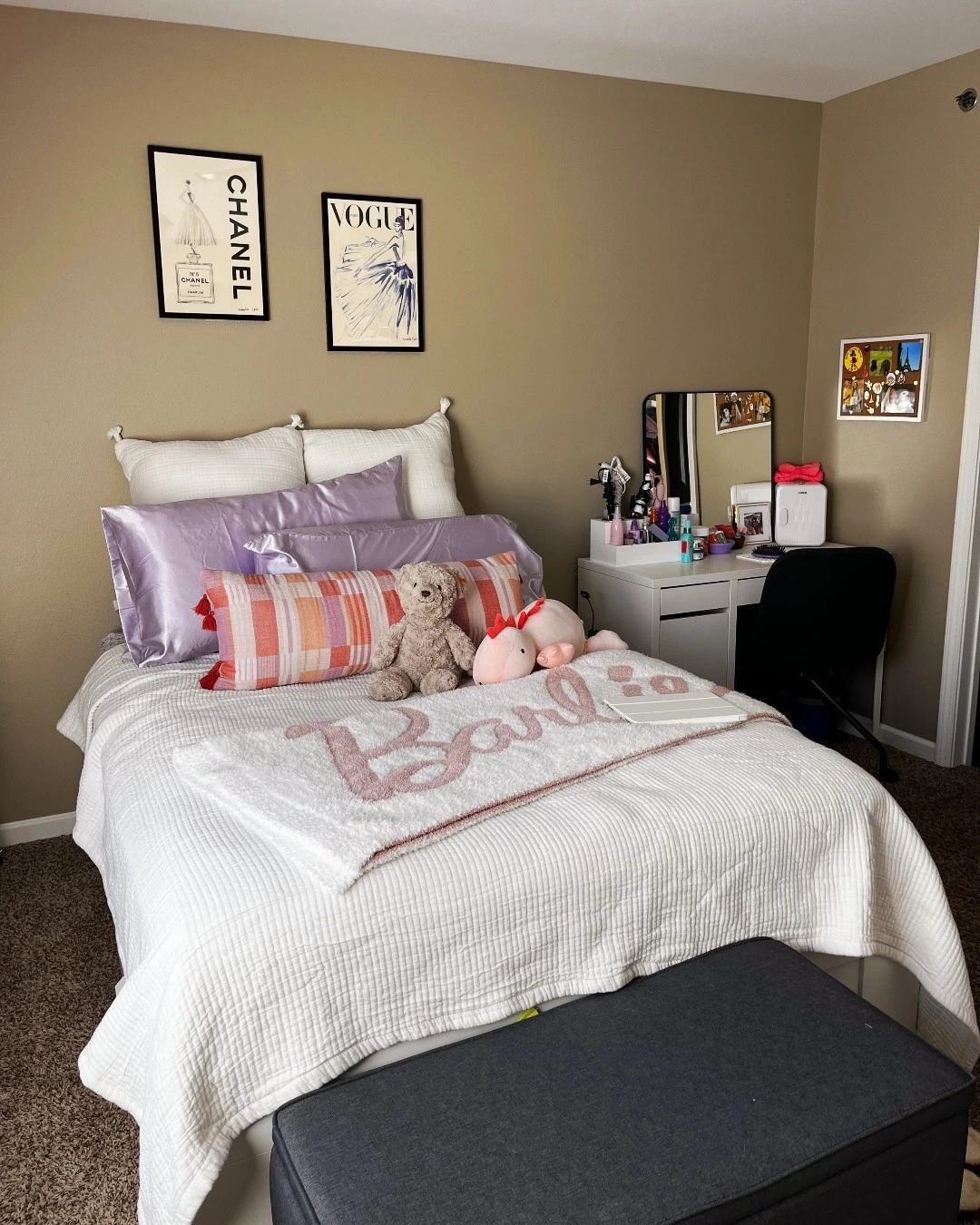 Bed with chic fashion posters on the wall.  